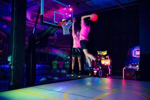 teens playing indoor hoops