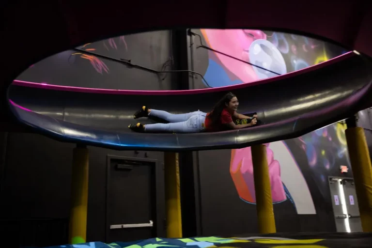 girl playing on indoor slide park